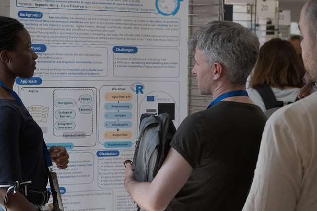 GCC2026 attendees discussing posters during a poster session.