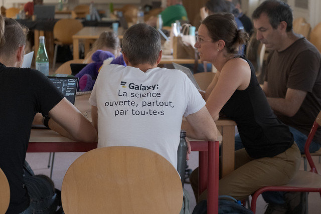 A GCC2026 attendee wearing a Galaxy-themed T-shirt during a discussion.